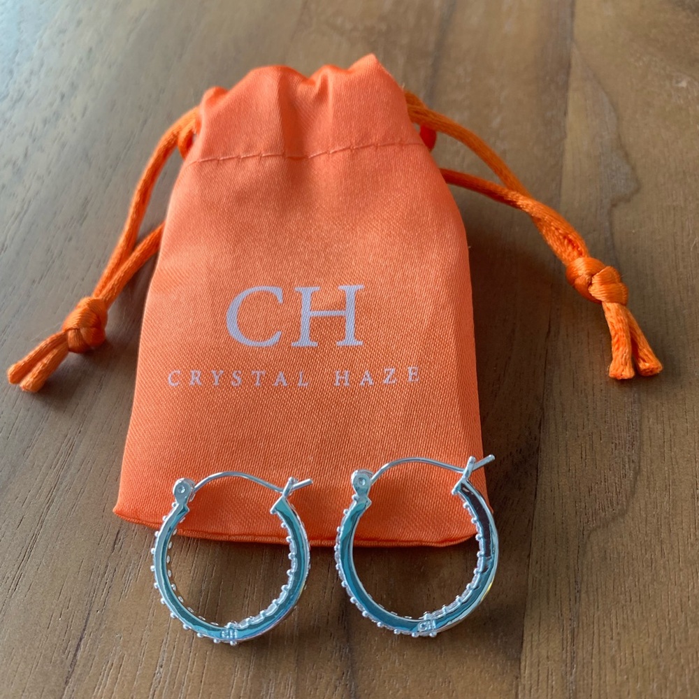 NEW 🎀 Silver plated w/clear CZ stones. 3/4” hoops. CH stamped. Storage bag.